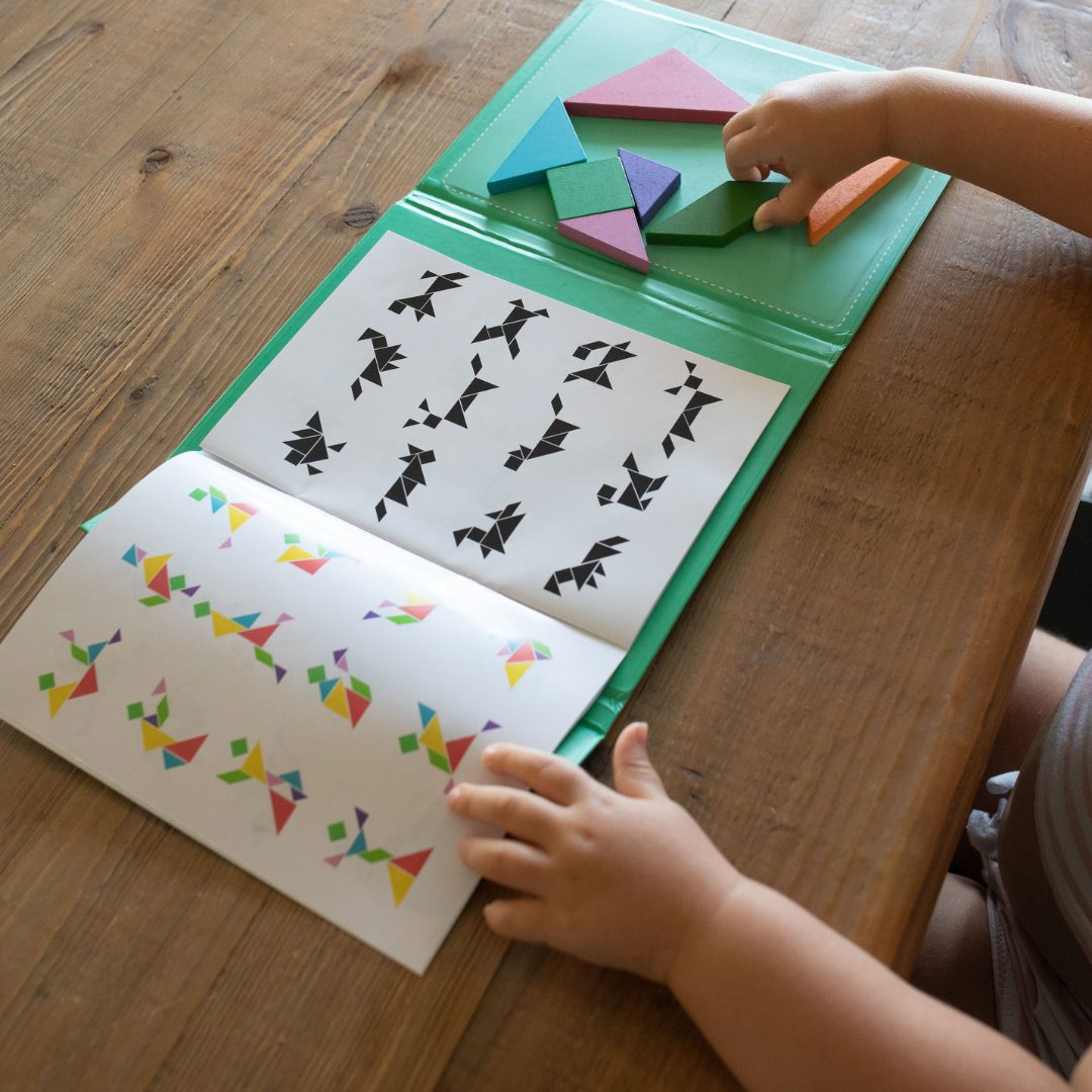 Travel Tangram Set with magnetic puzzle pieces. Two levels of difficulty, so it grows with your child! Perfect gift for kids ages 3-6 years old!