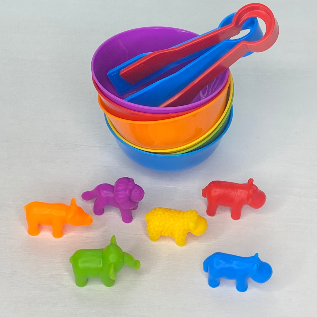 Animals and cups with tongs to help teach colors and number recognition.